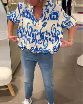 Elegant long-sleeved top with printed V-neck